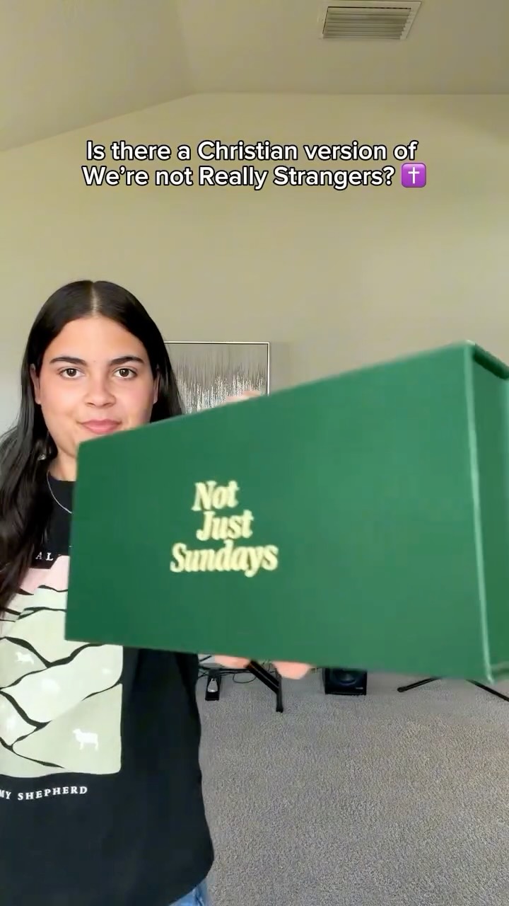 Creator holding a green Not Just Sundays box, with the text 'Is there a Christian version of We're Not Really Strangers?'